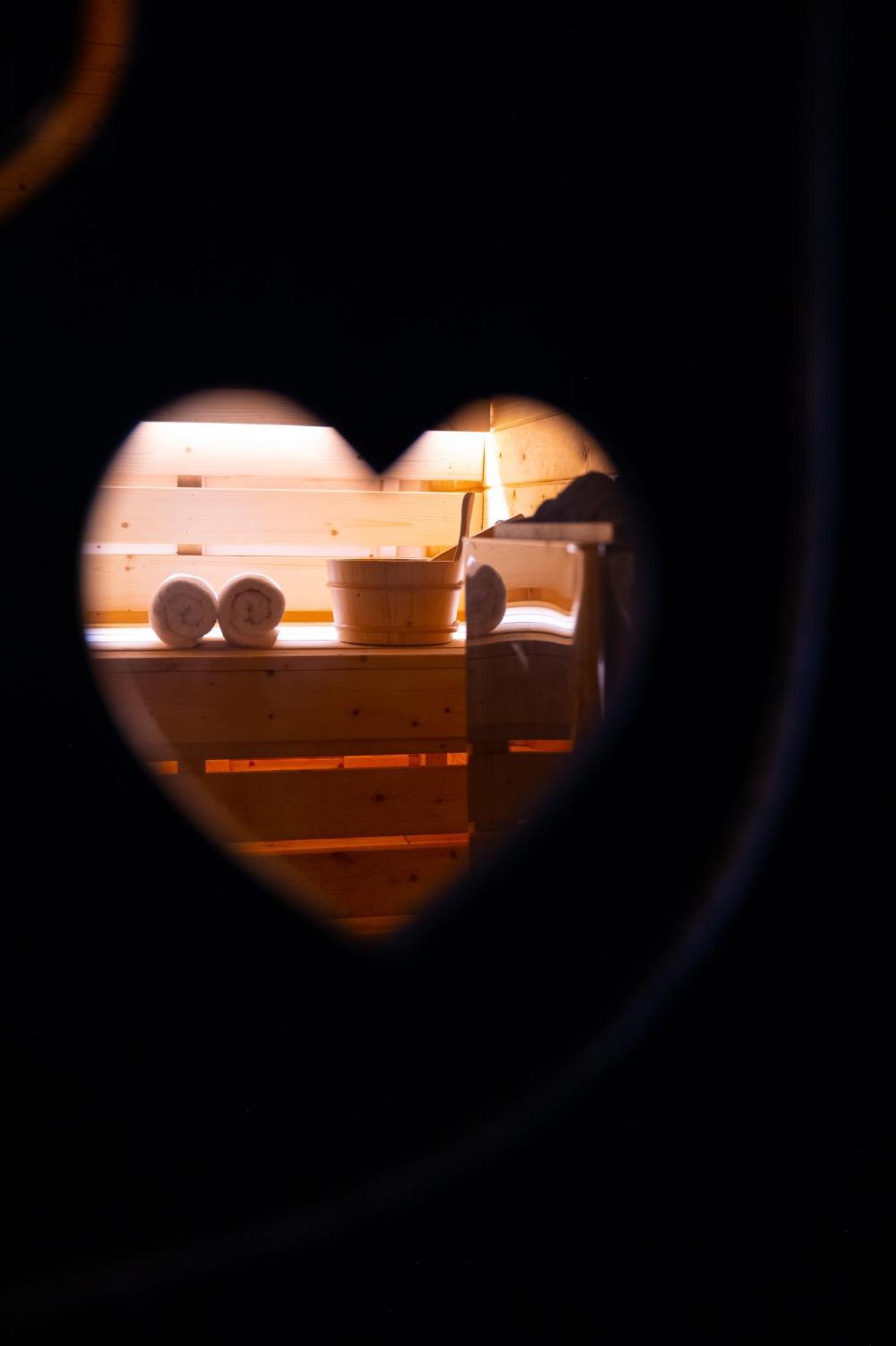 Arka Art Hotel Tirana Zewnętrze zdjęcie A heart-shaped hole in a sauna door
